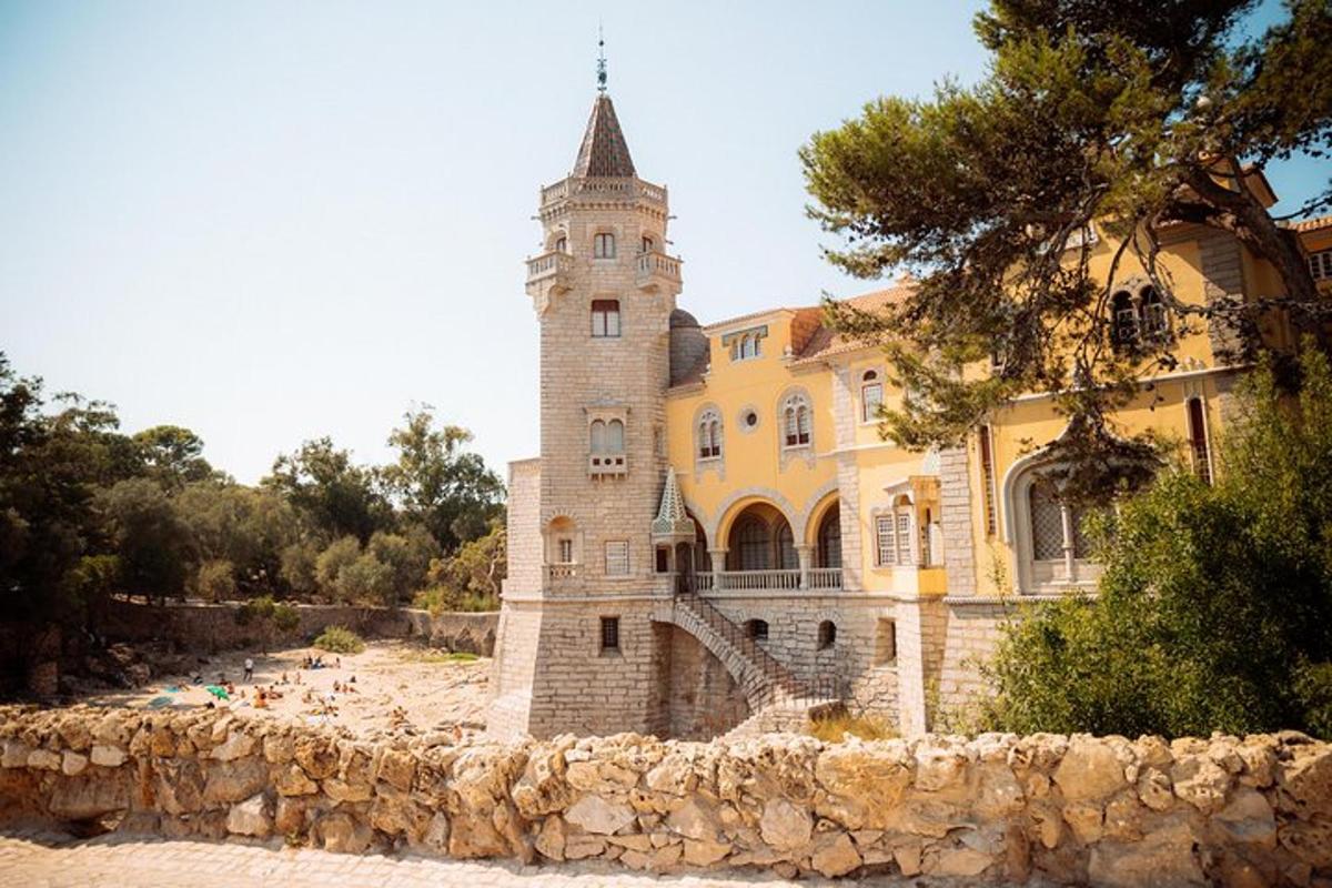 a building with a tower on top of a stone wall