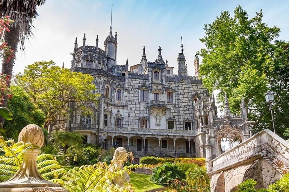 an old mansion with a garden in front of it