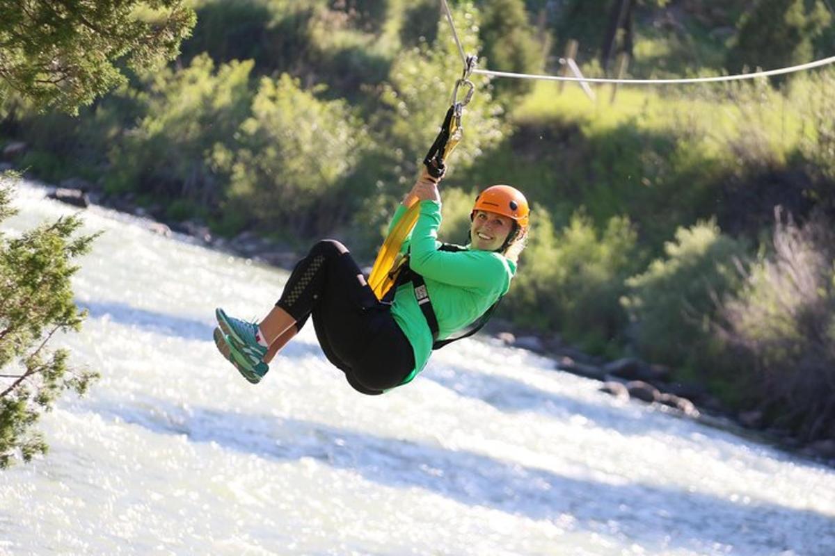a man flying through the air on a parachute