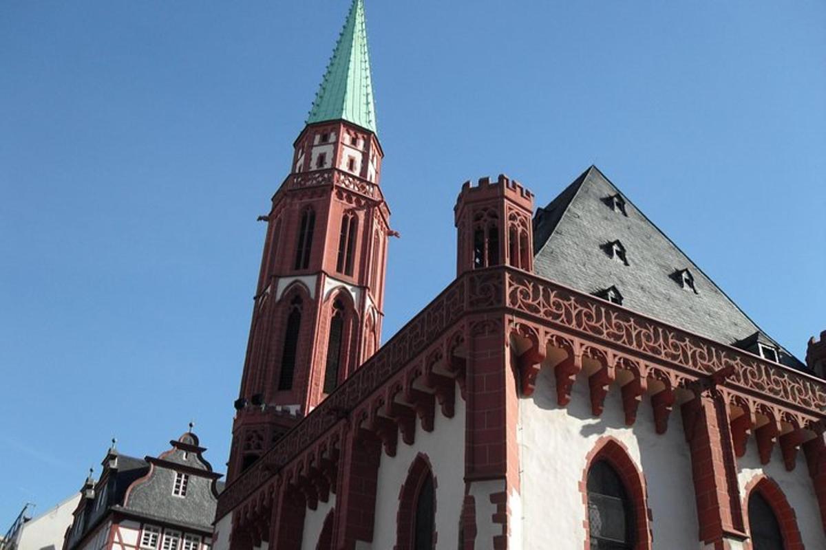 a building with a tower with a green steeple
