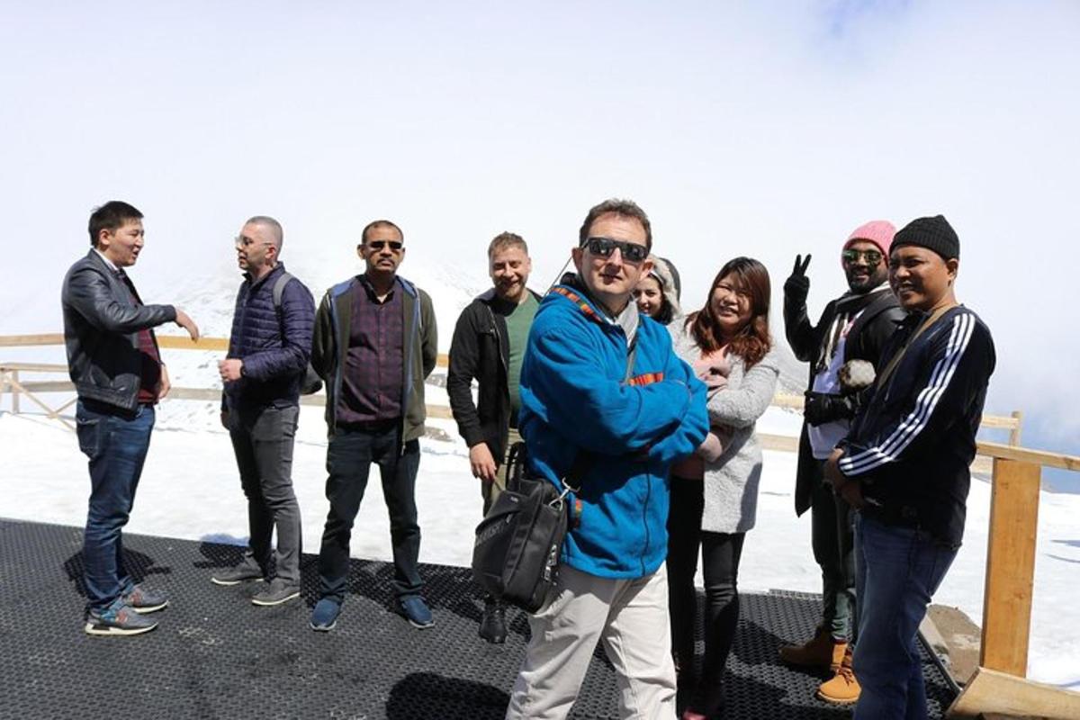 a group of people standing on the top of a mountain
