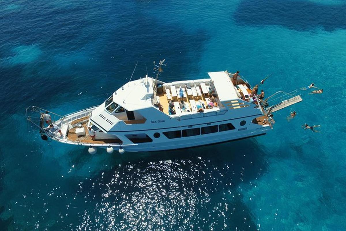 a boat with people on it in the water