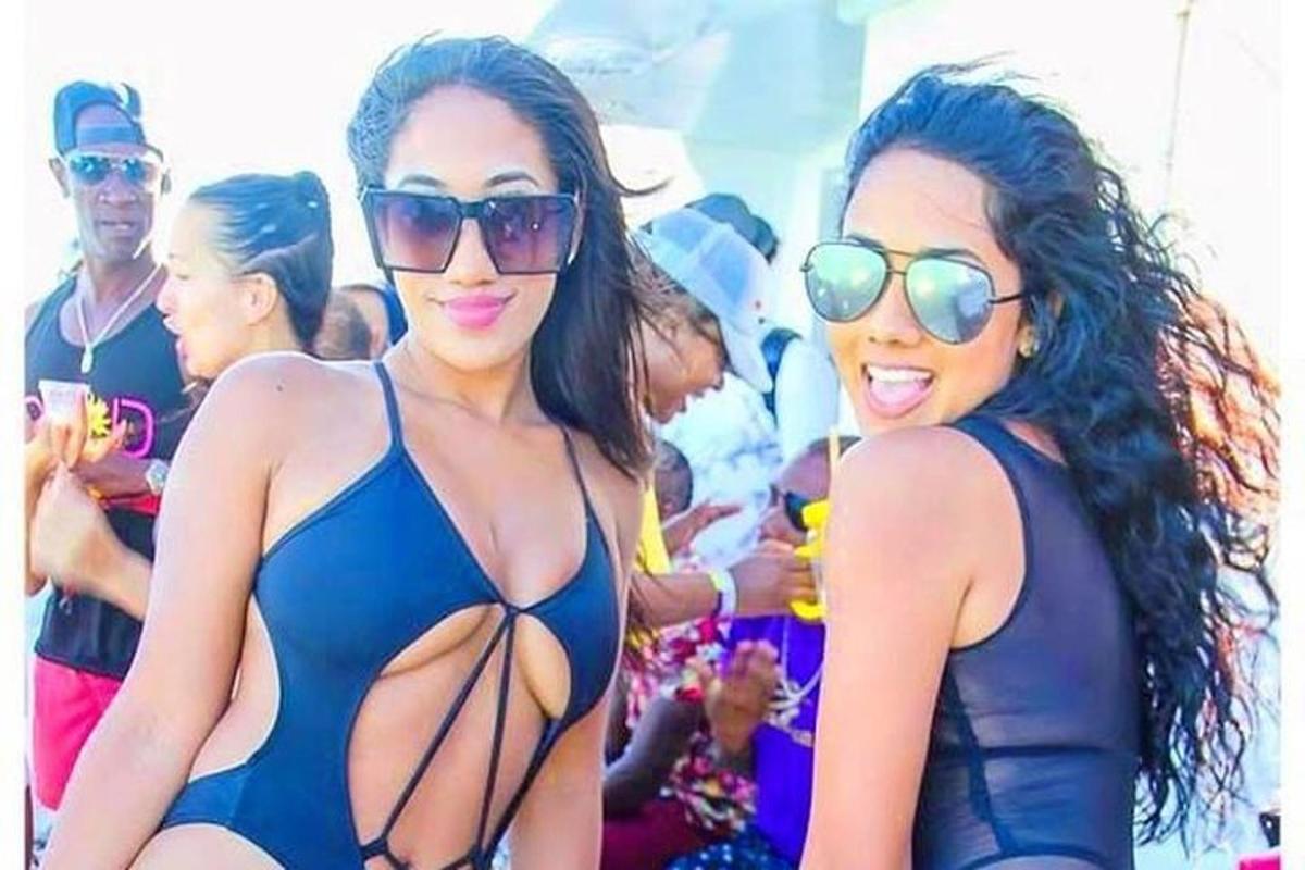 two women in bathing suits posing for a picture