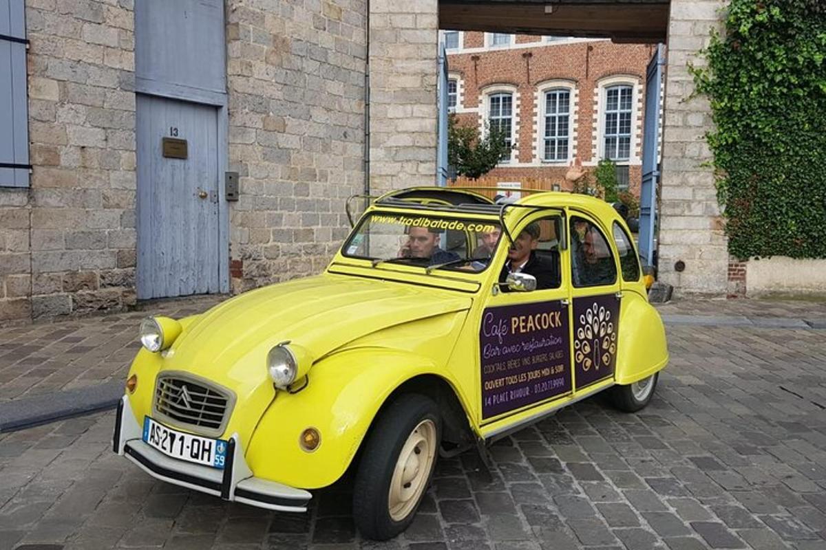 a yellow car with two people sitting in it