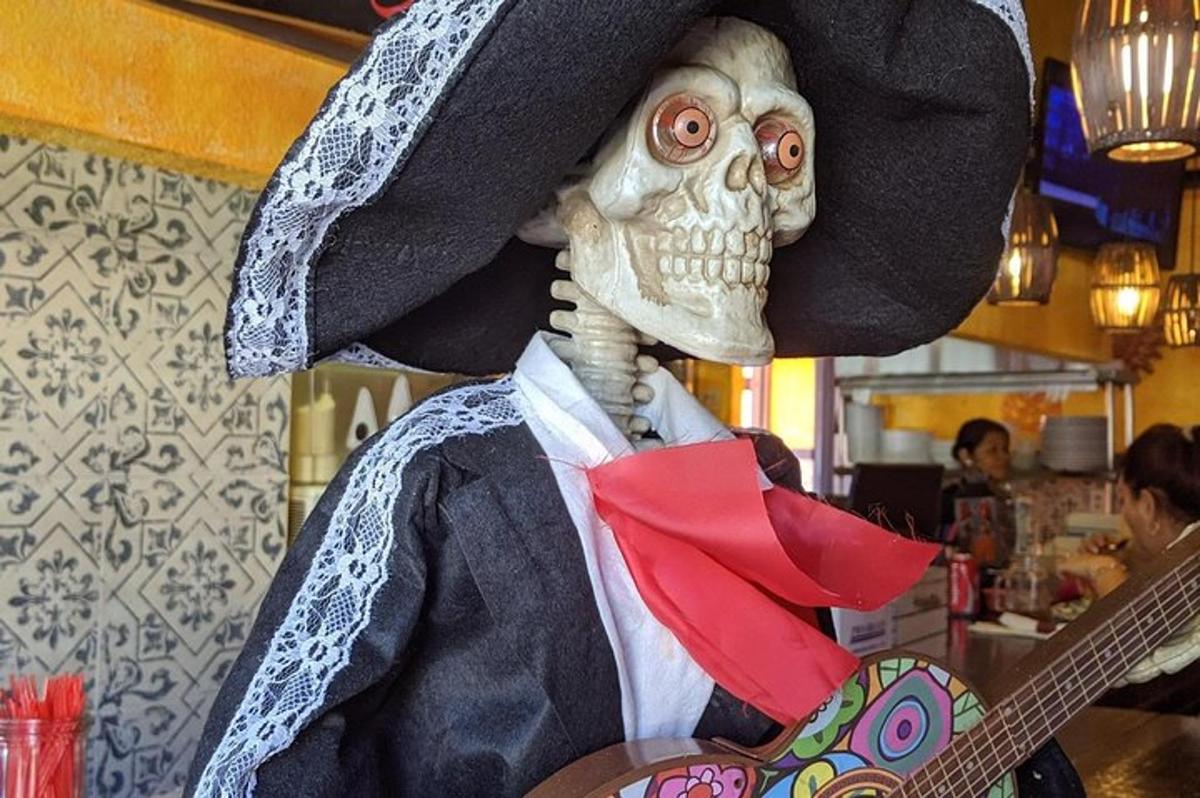 a person wearing a skeleton wearing a black hat