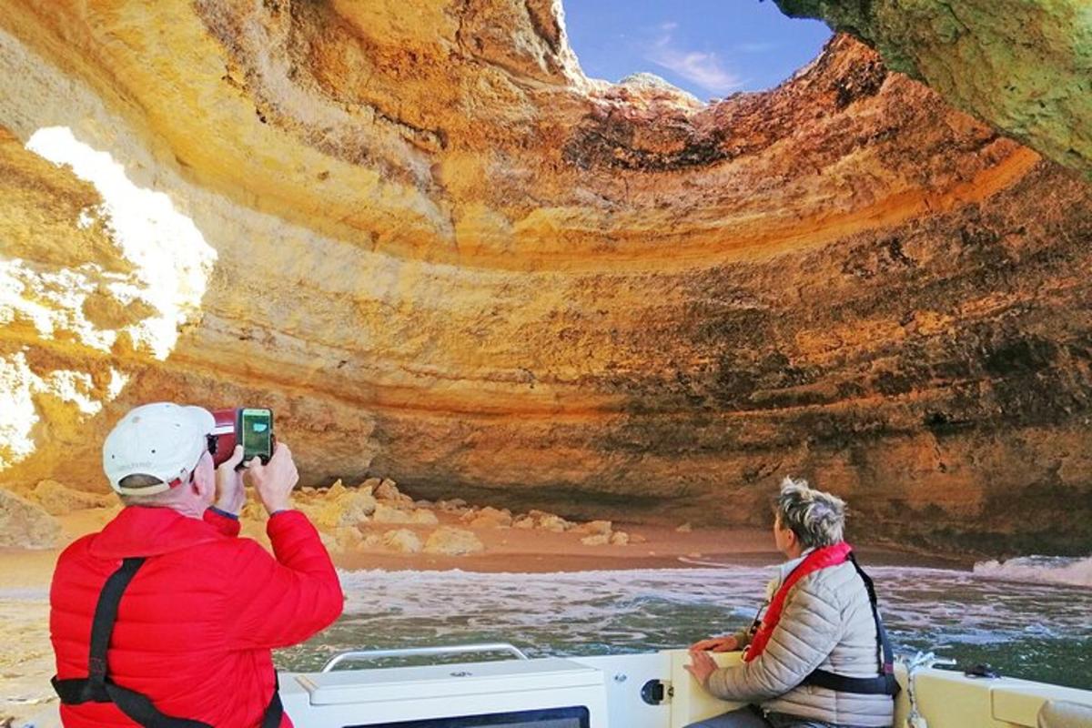 a man taking a picture of a woman in a boat