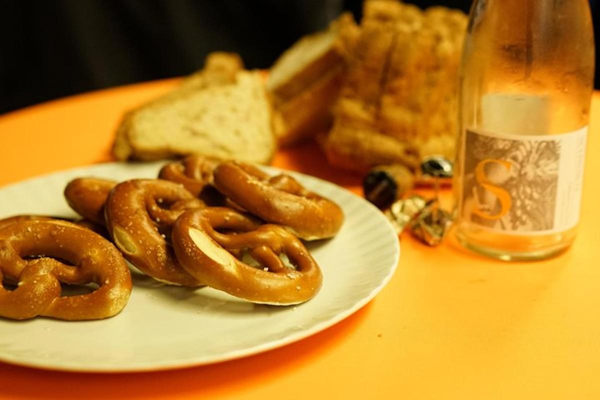 a plate of pretzels and bread on a table