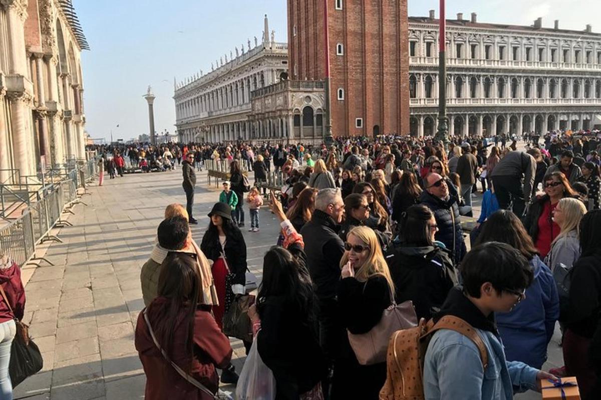 a large crowd of people standing in front of a building