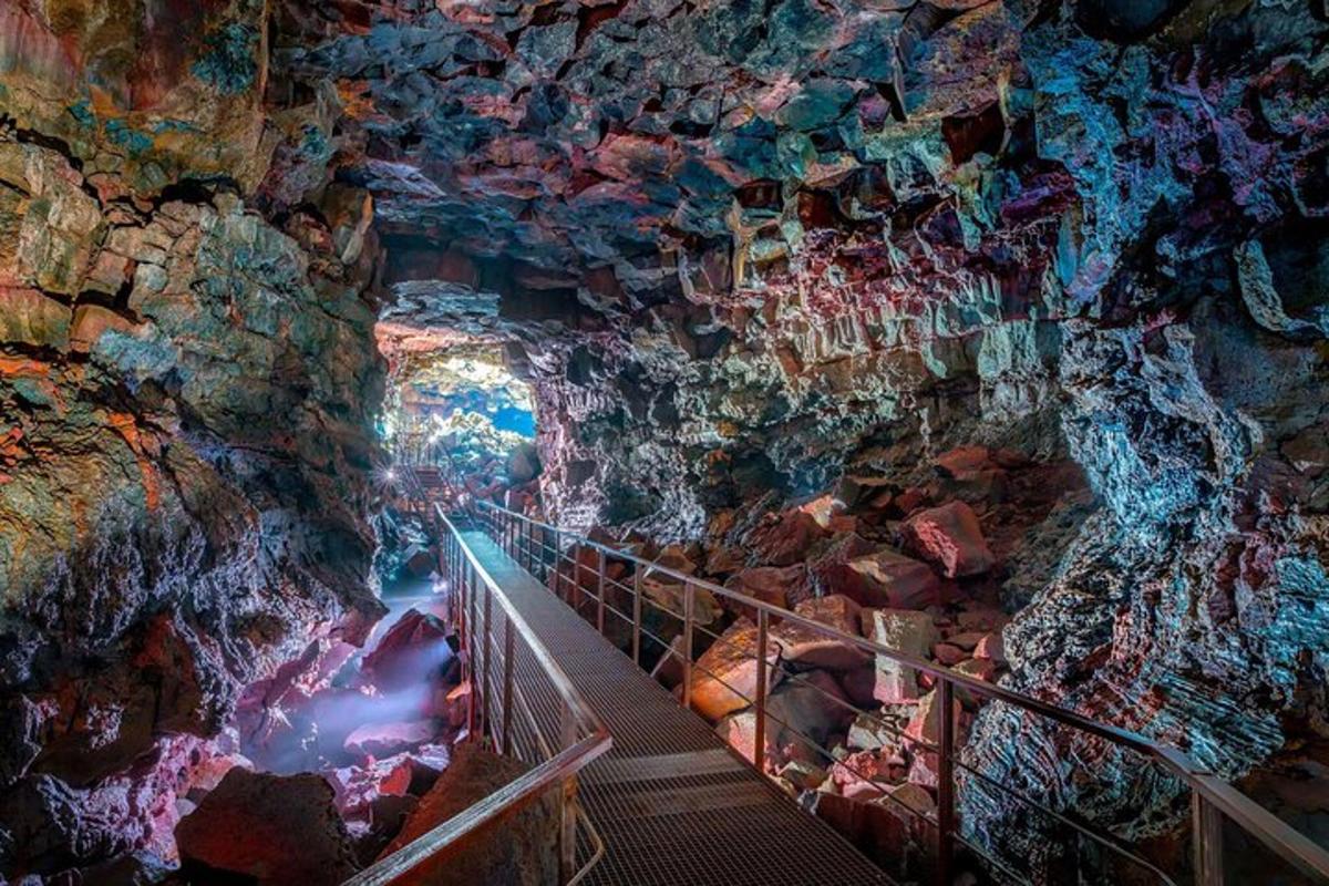 a tunnel in a cave with a staircase in it