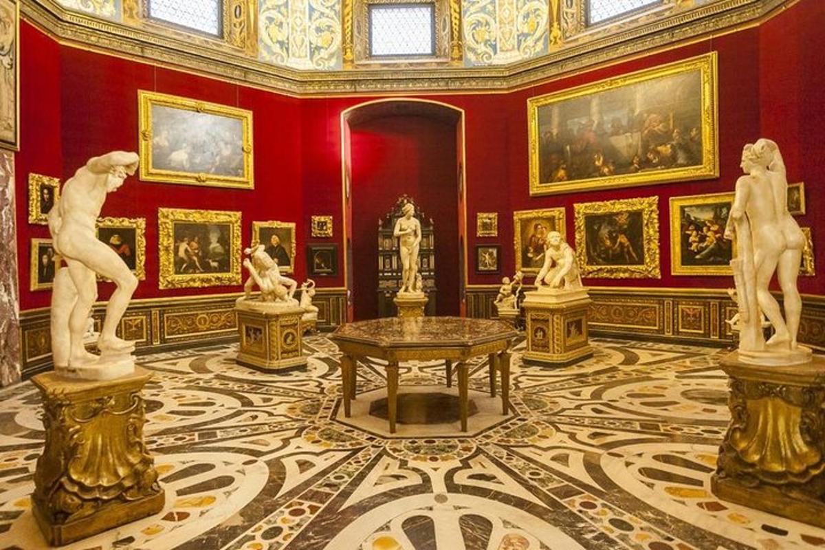 a room with statues and paintings on the walls