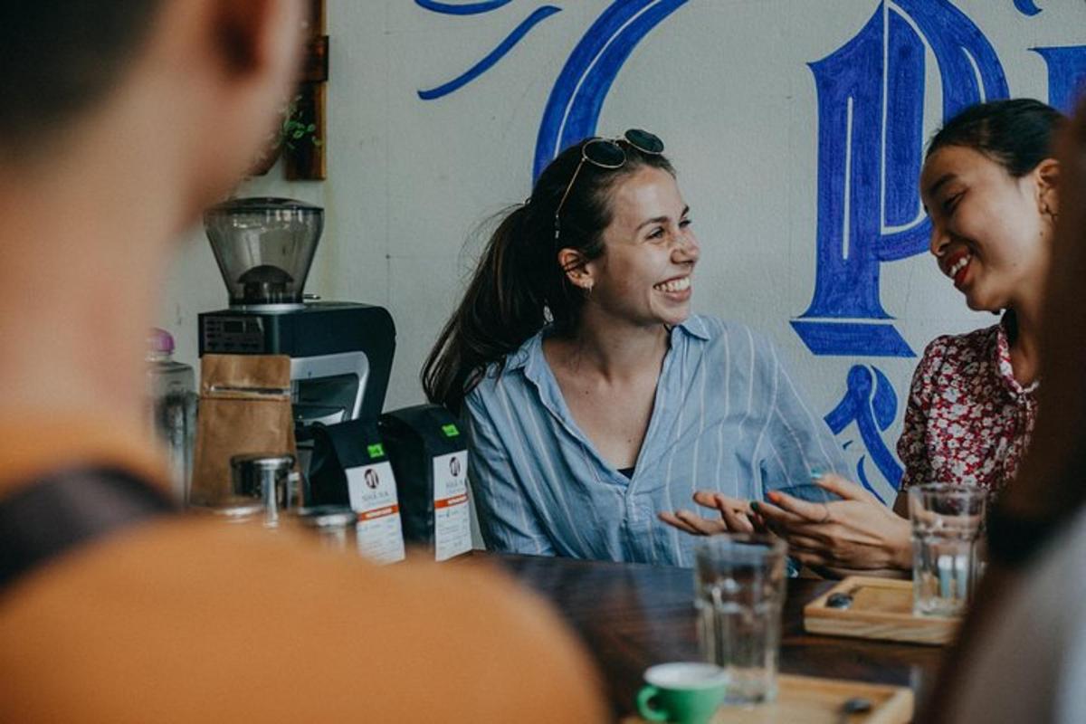 a group of people sitting at a table talking