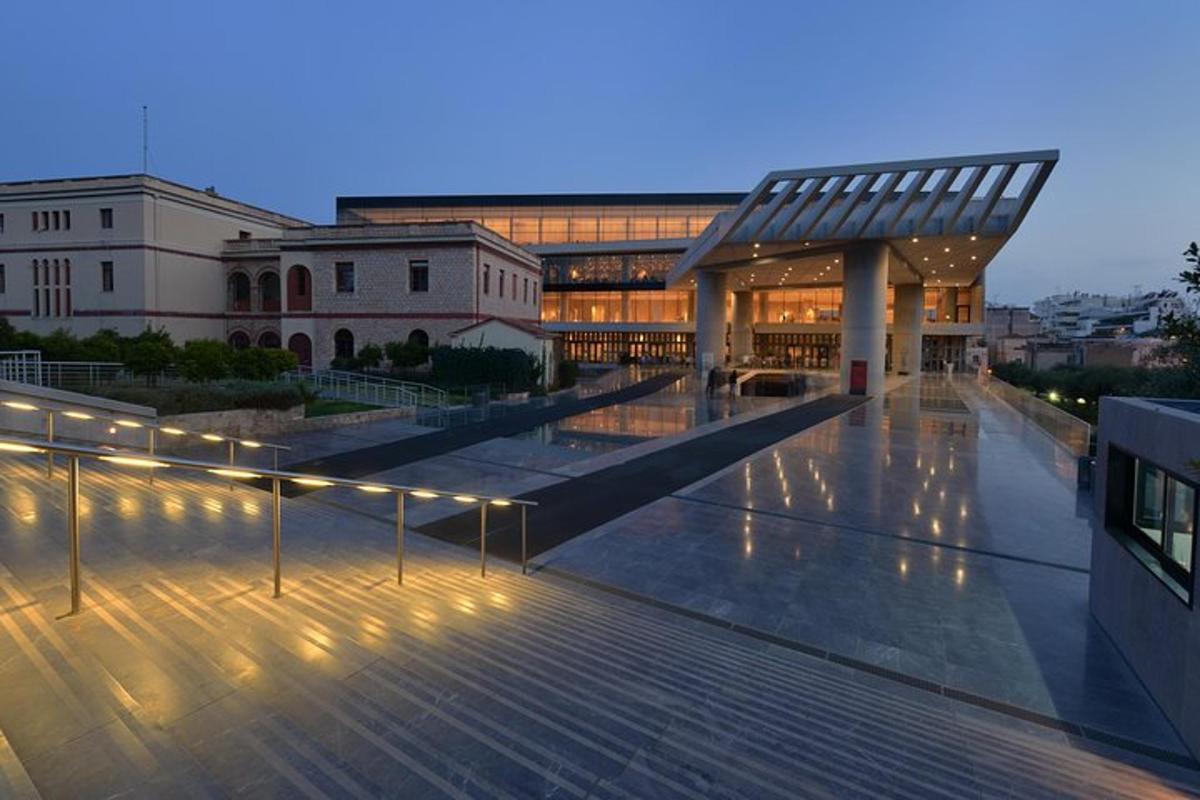 a view of a building with lights on the roof