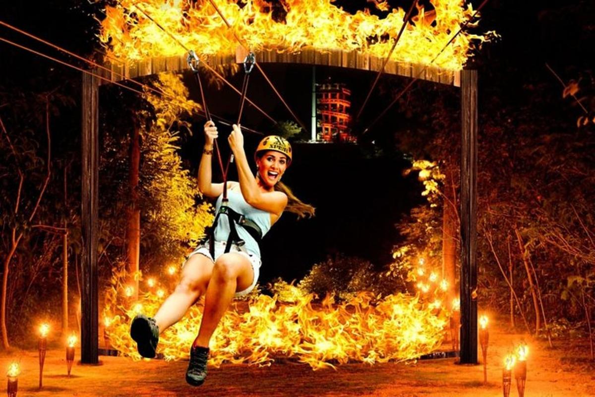 una donna è su una corda davanti al fuoco