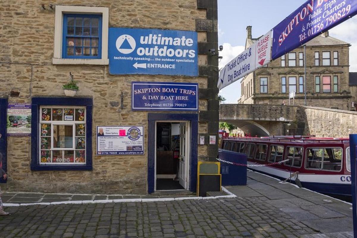a train station with a building with a train