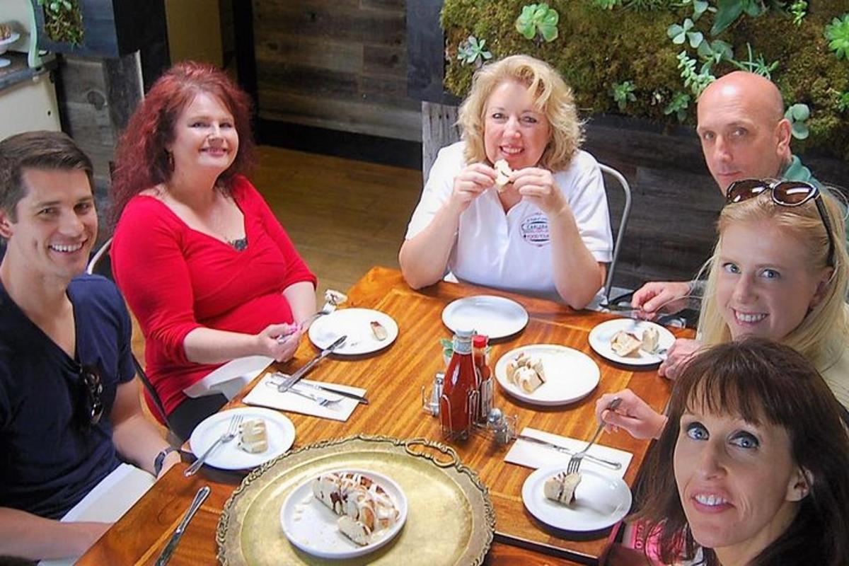 a group of people sitting around a table eating