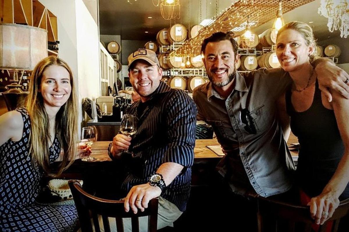 a group of people posing for a picture at a bar