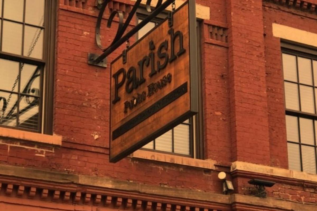 a sign on the side of a brick building