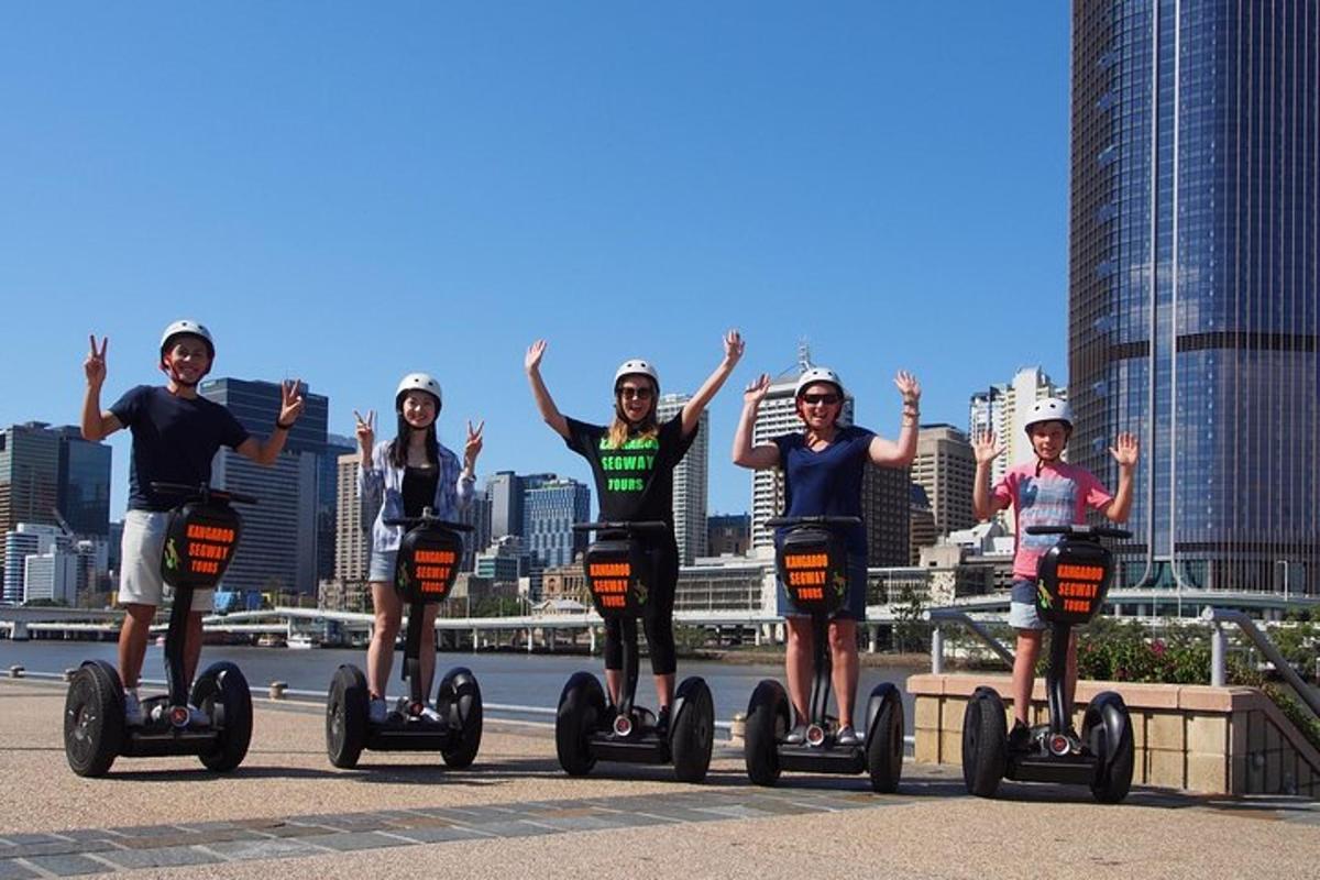 a group of people are riding on segways