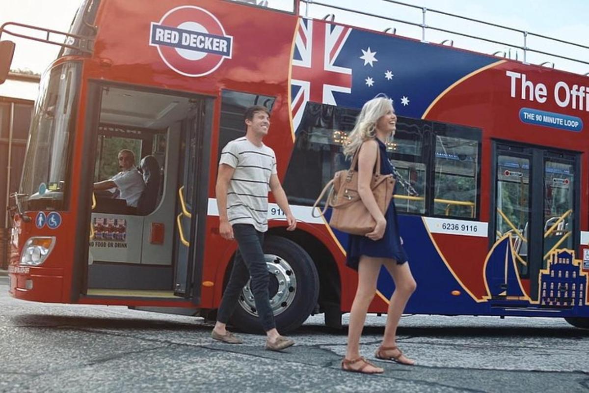 a man and a woman getting on a bus