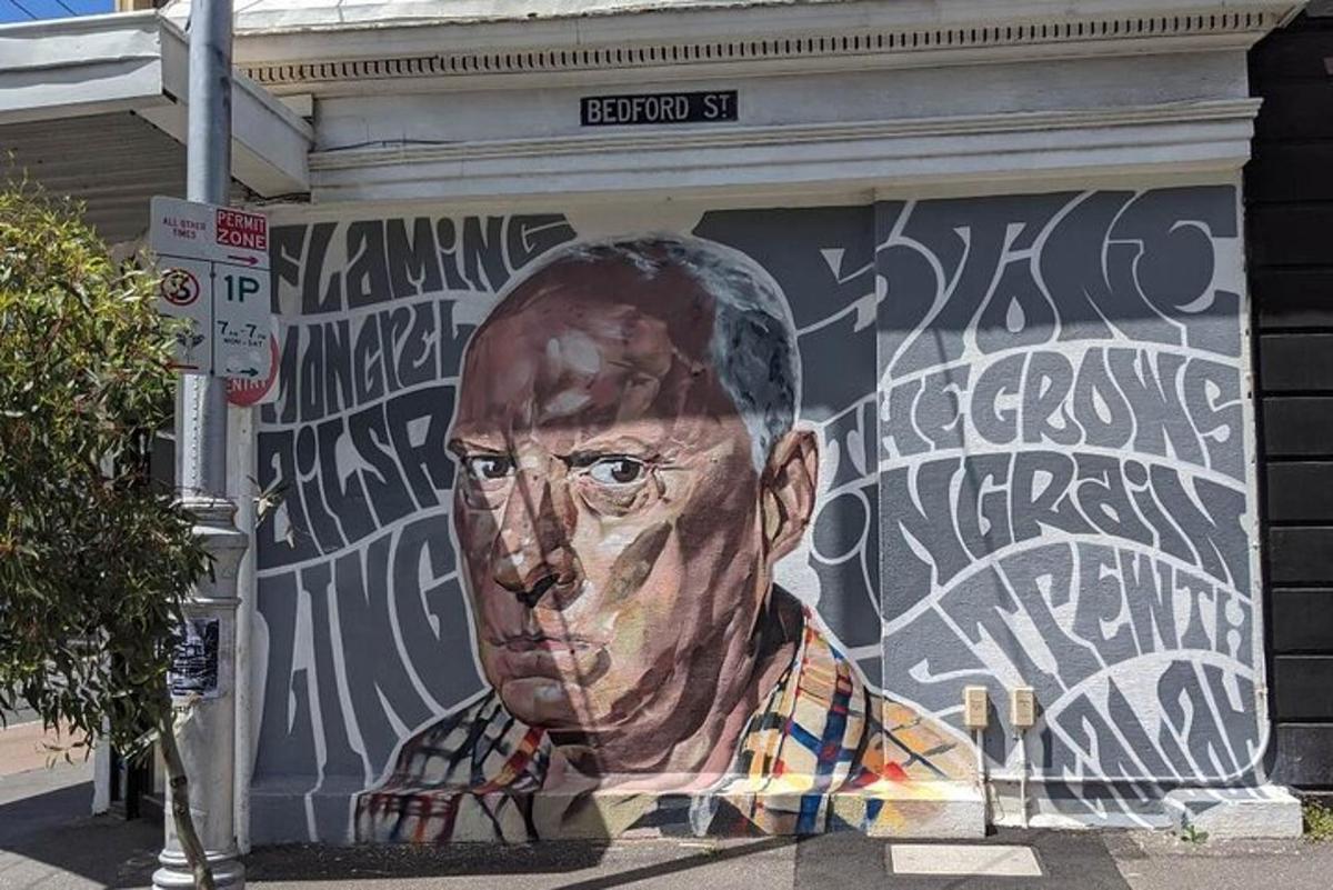 a painting of a man on the side of a building