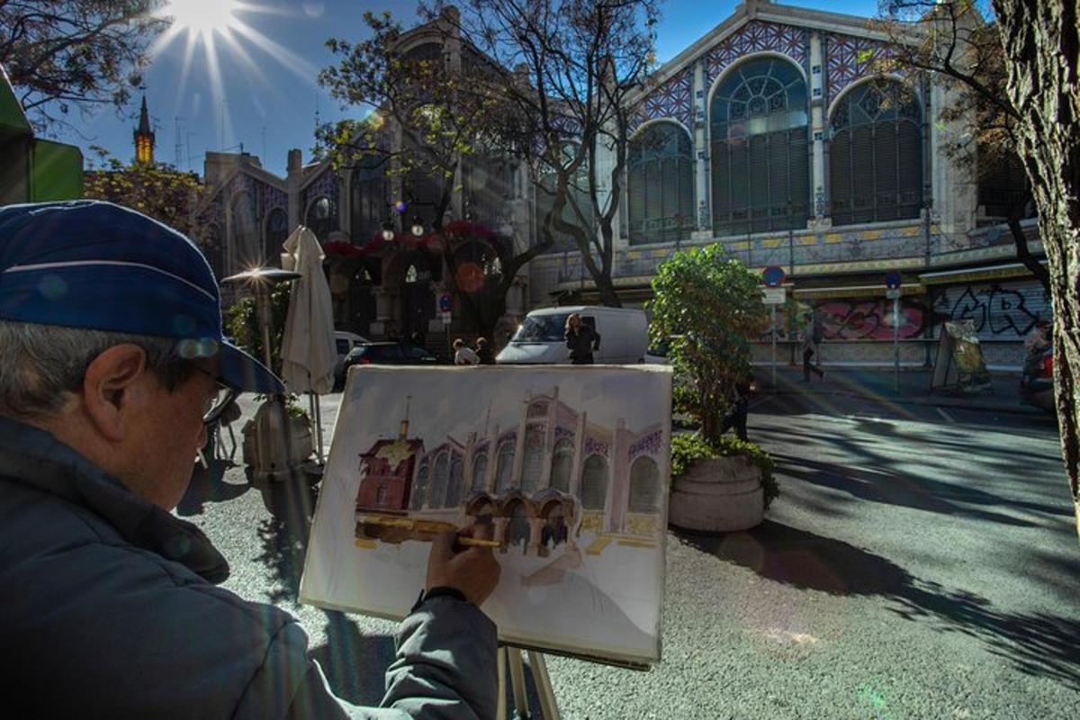 a man is painting a picture of a building
