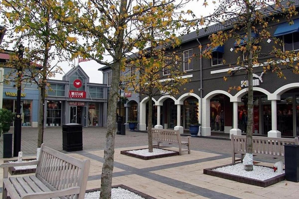 a street with benches in front of a building