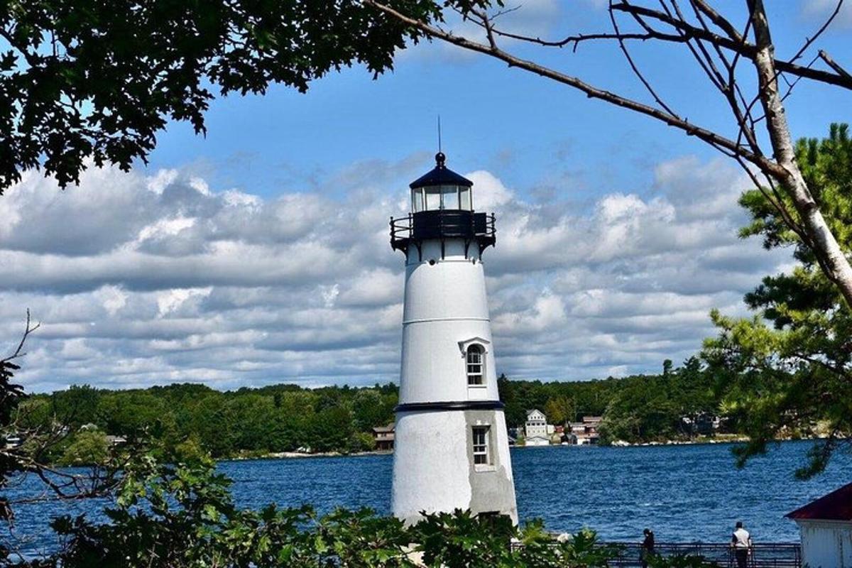 a lighthouse sitting in the middle of a body of water
