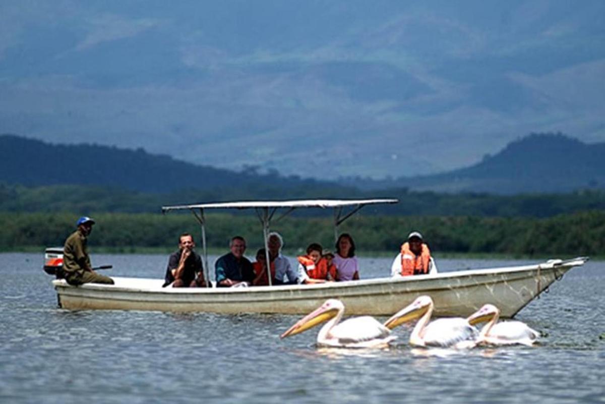a group of people in a boat on the water