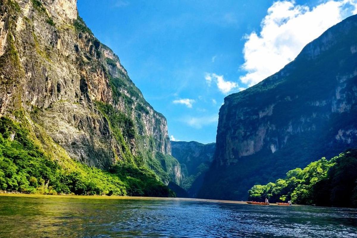 a view of a river between two mountains