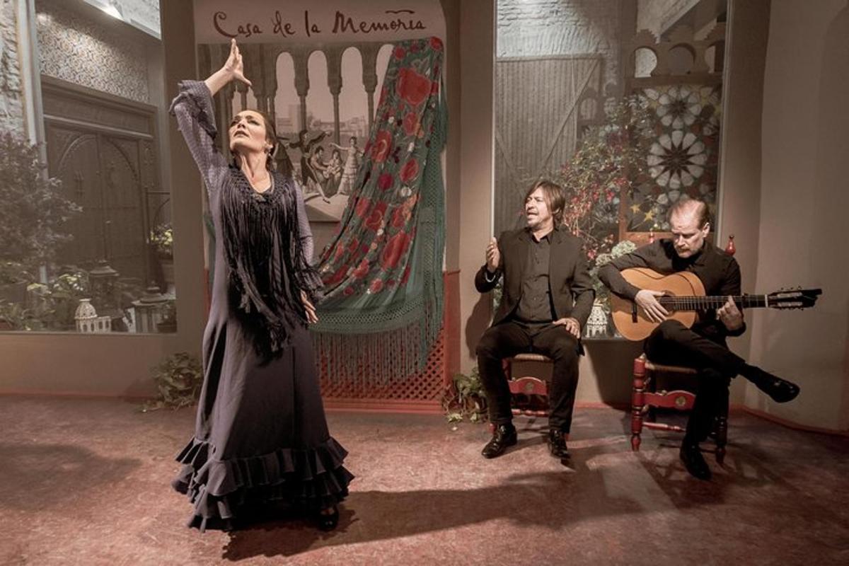 two men and a woman playing instruments and a man playing a guitar