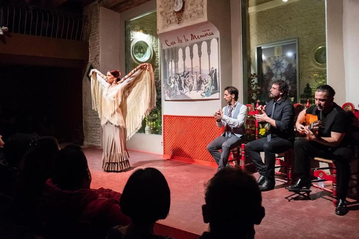 a group of people sitting on a stage with a performer