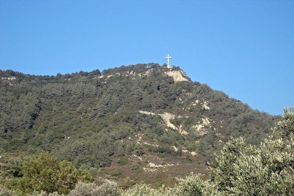 a cross on the top of a mountain