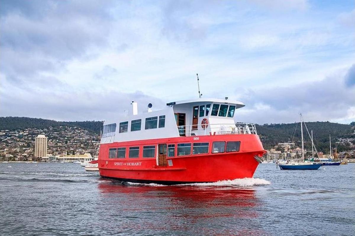 a red and white boat in the water