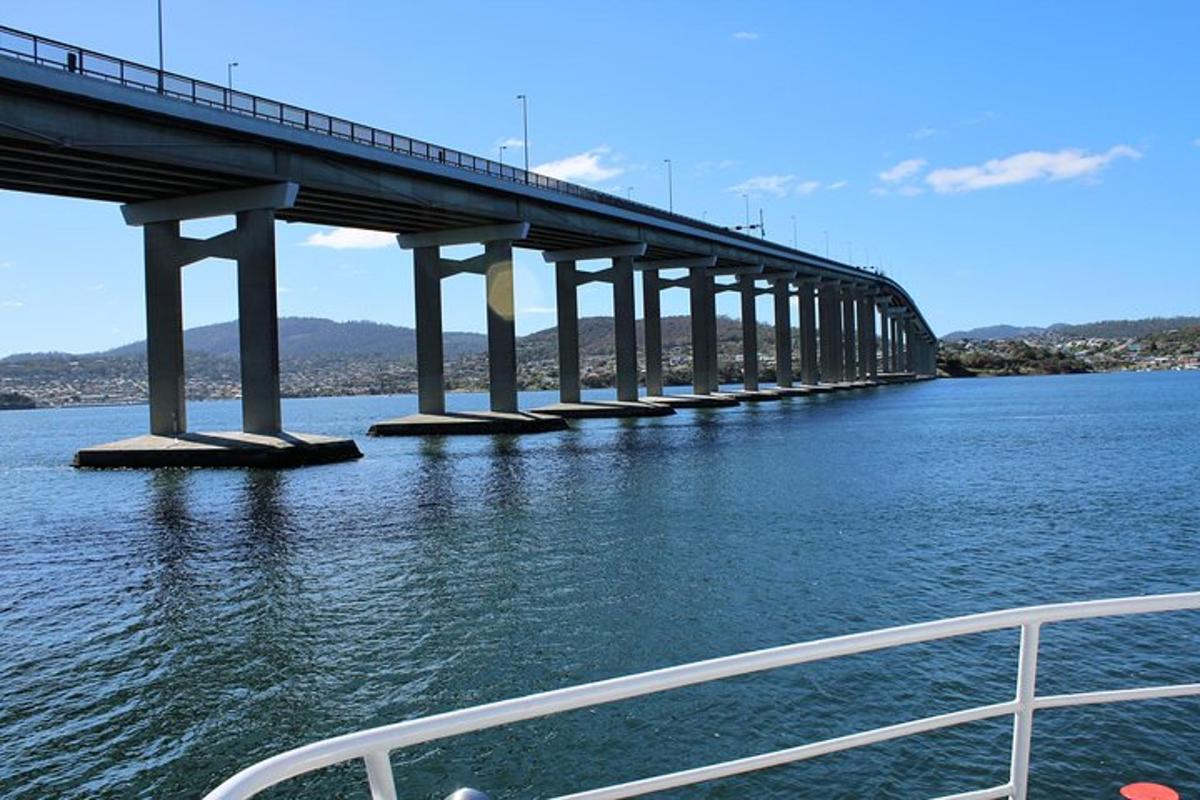 a bridge over the water with a boat