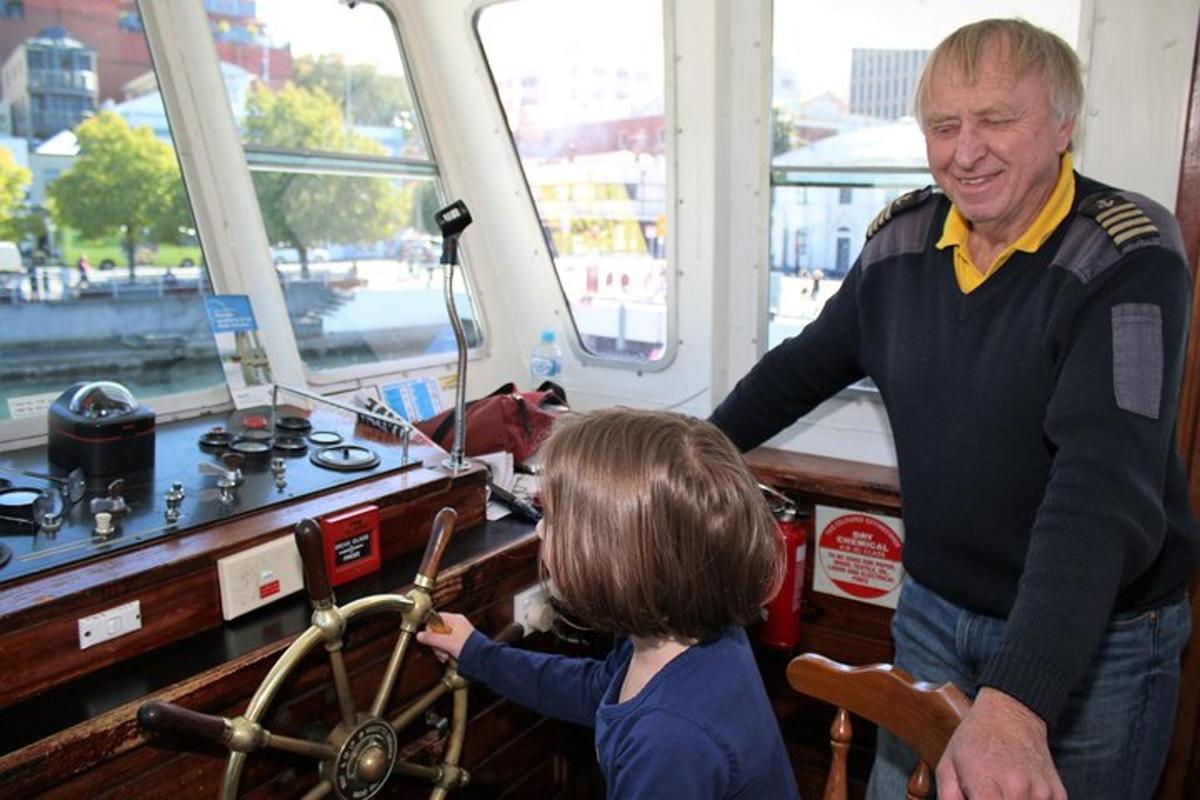 a man and a little girl on a boat