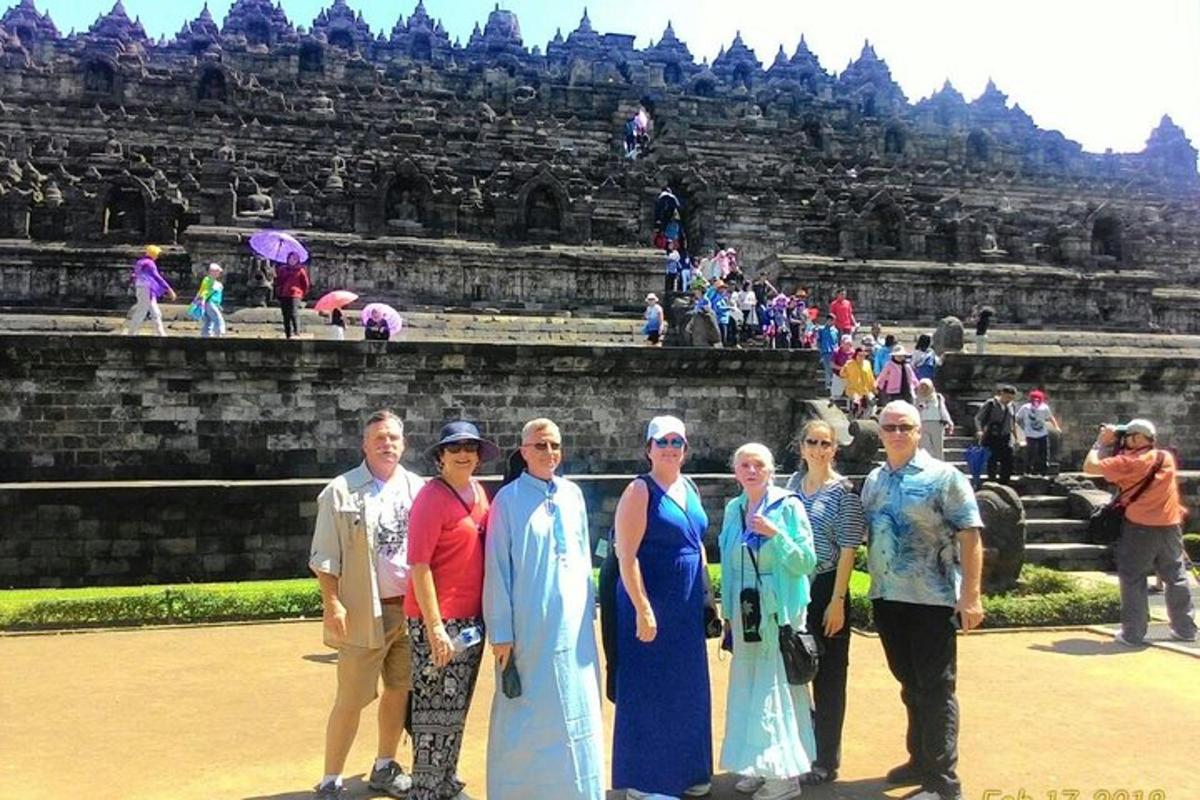 a group of people standing in front of a temple