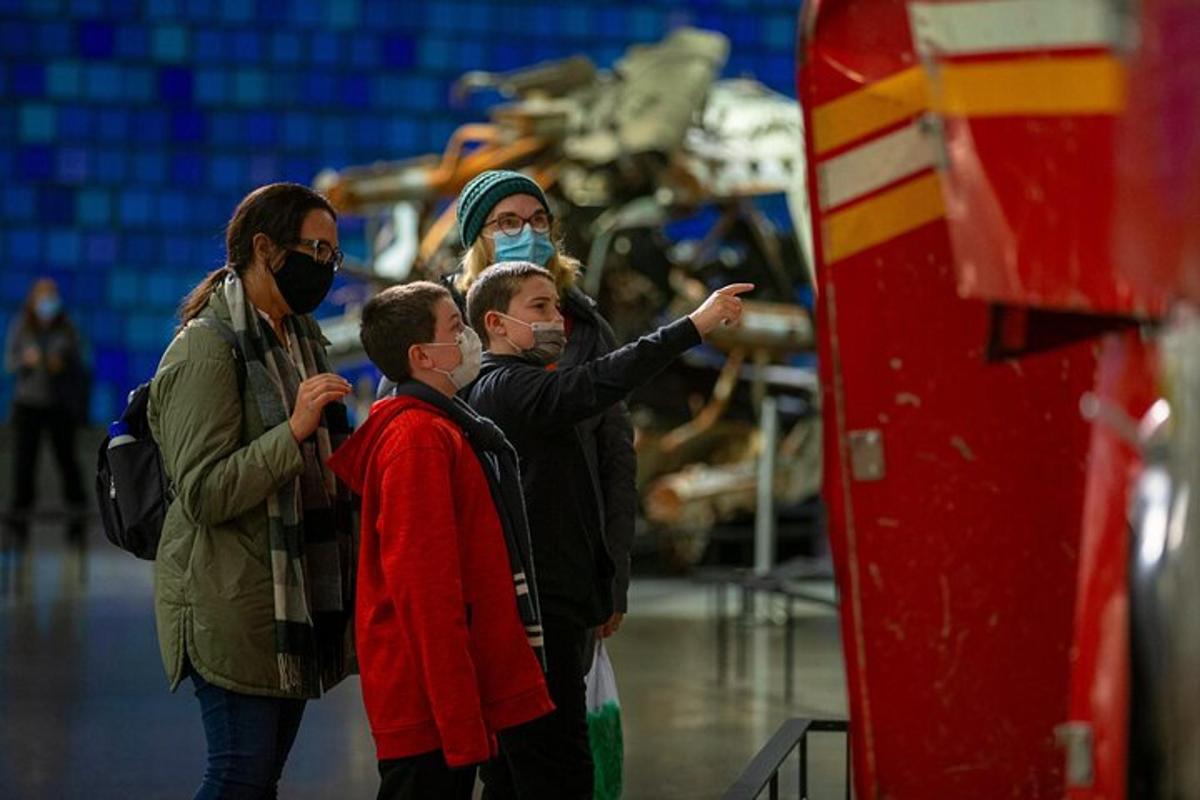 a group of people standing in front of a machine