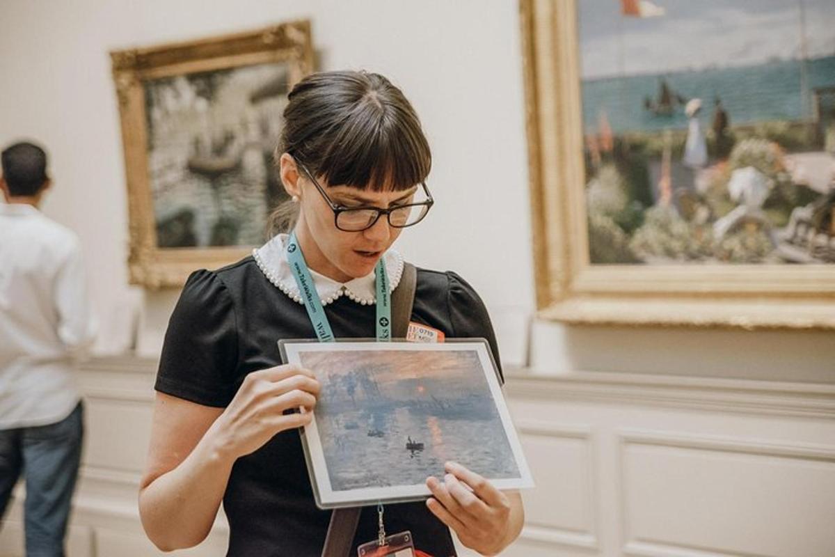 a woman is holding a tablet in a museum