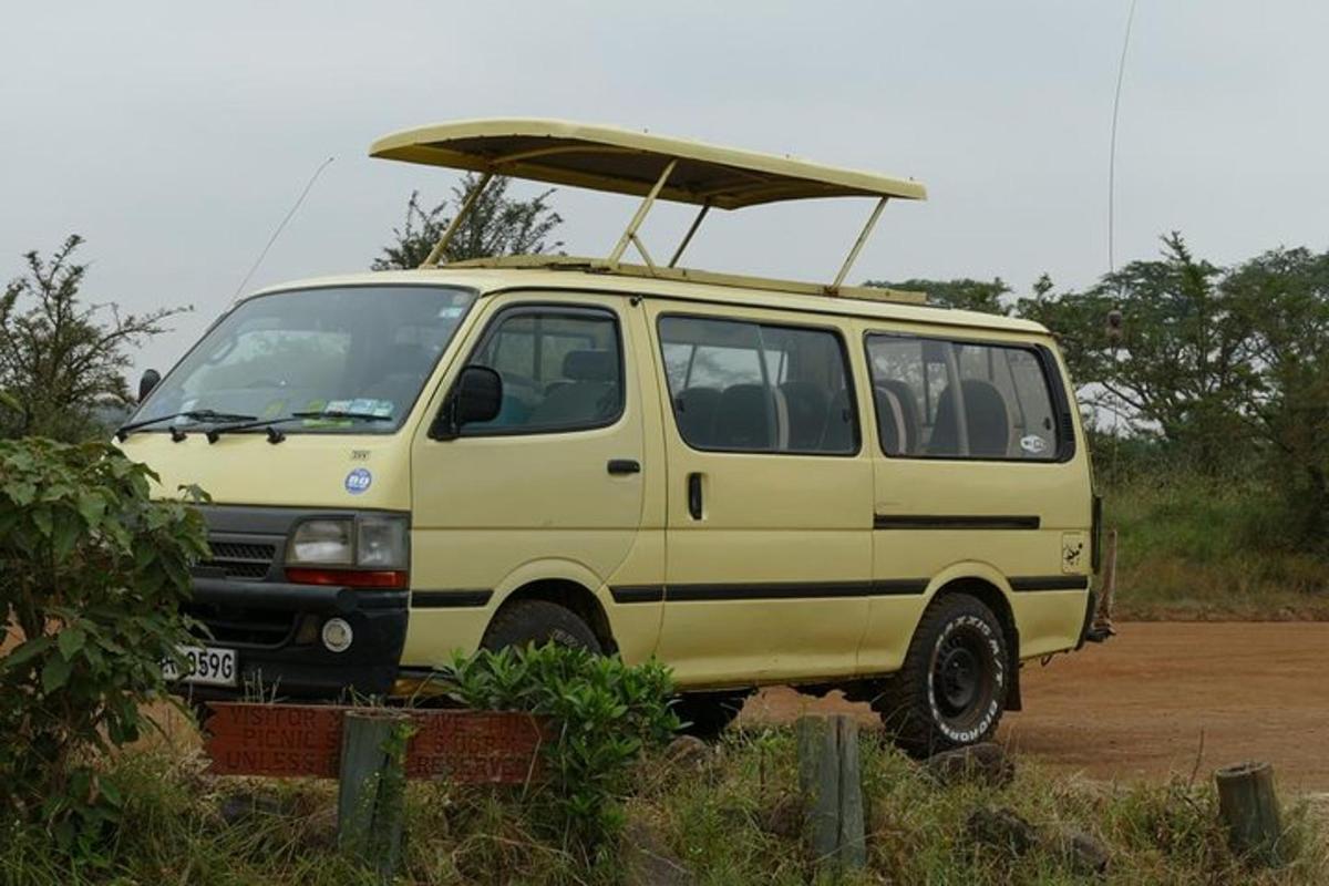 a yellow van with a surfboard on top of it