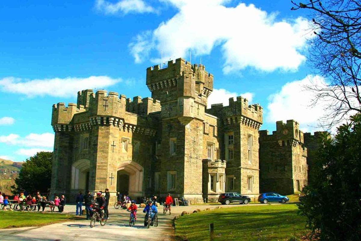 a castle with a bunch of people in front of it