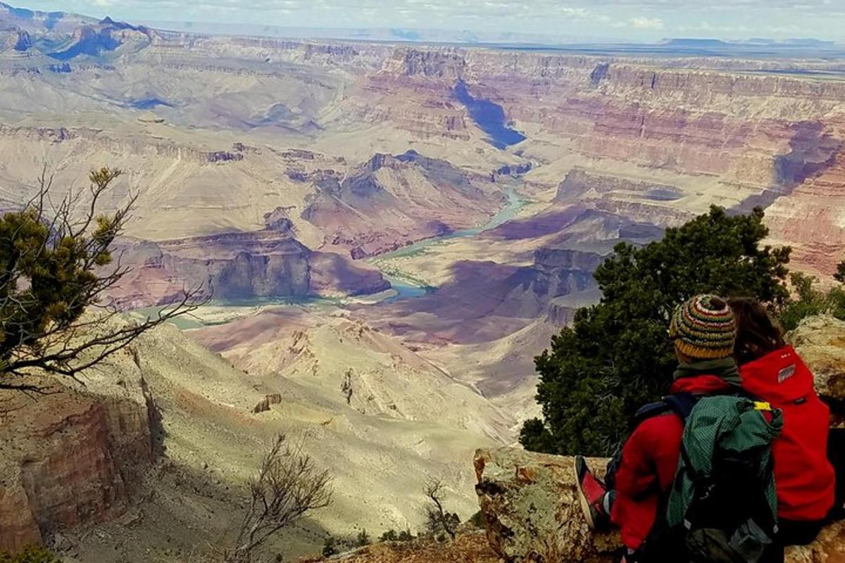 a person standing on the edge of the grand canyon