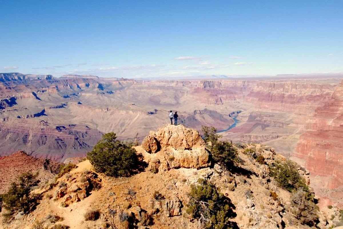 a man is standing on top of a mountain