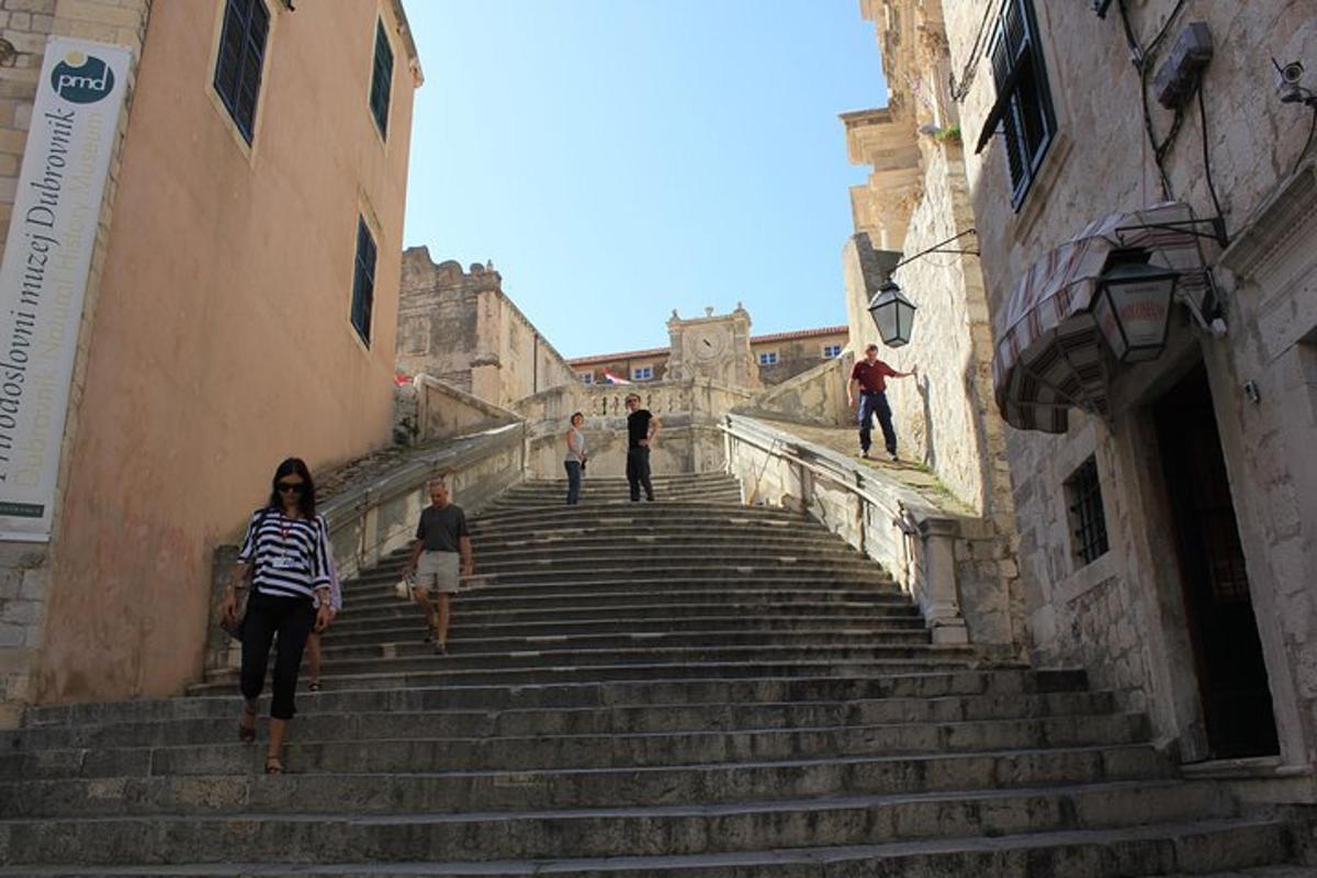 a group of people walking up a set of stairs