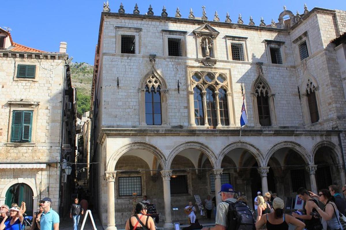 a group of people standing in front of a building