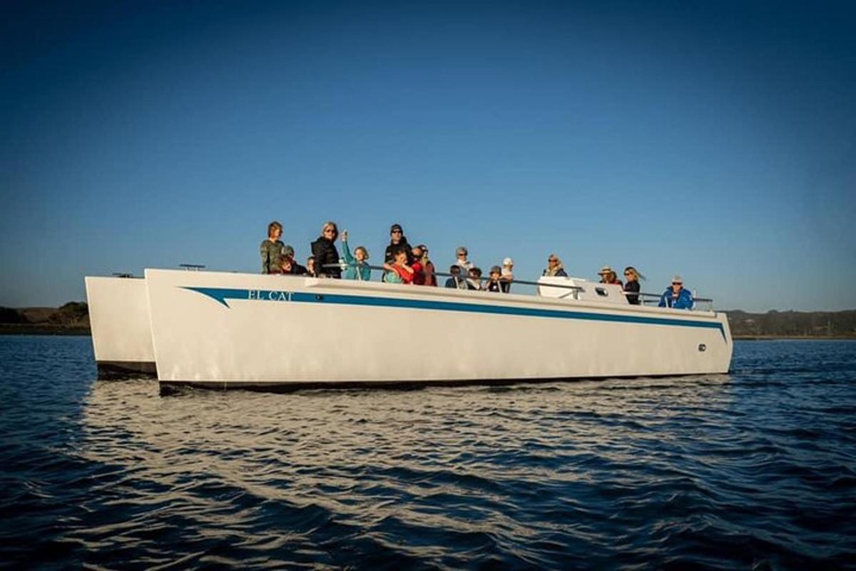a group of people on a boat in the water