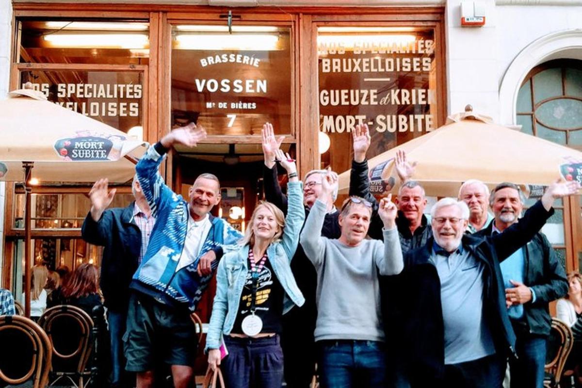a group of people with their hands in the air