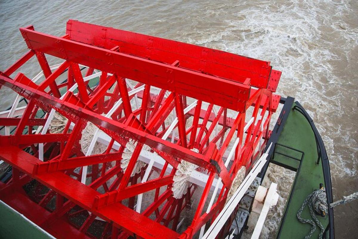 an overhead view of a red structure on a boat in the water