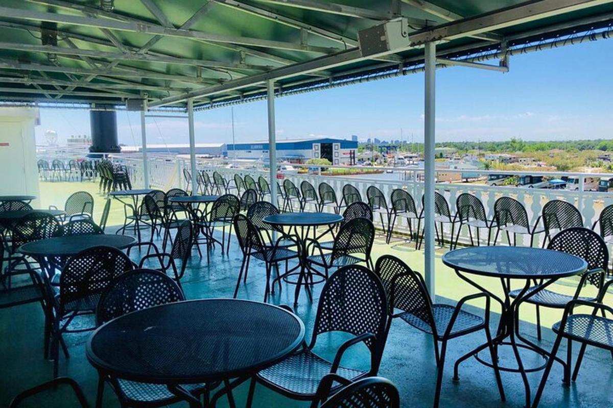 a group of tables and chairs sitting on a balcony