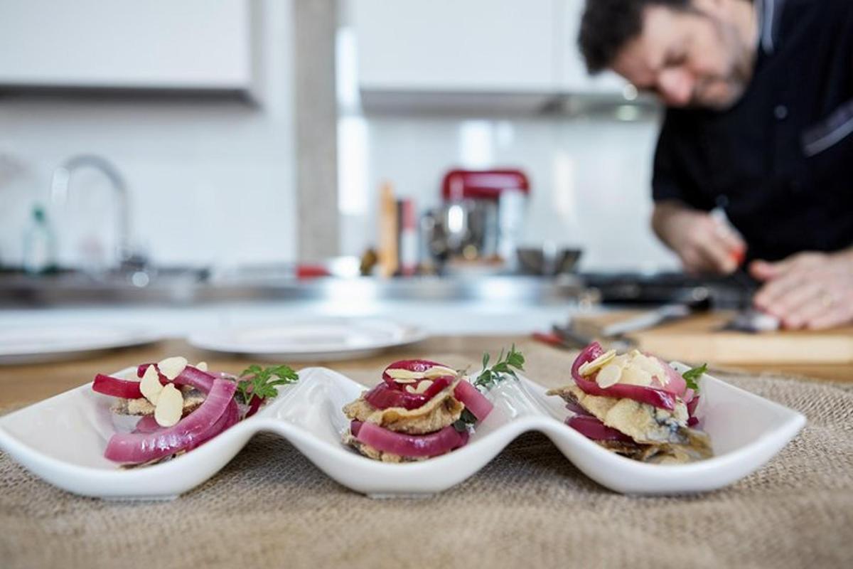 a couple of spoons with food on a counter