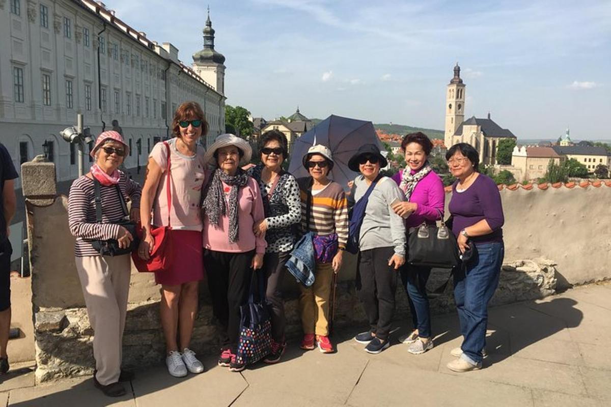 a group of women posing for a picture on a bridge